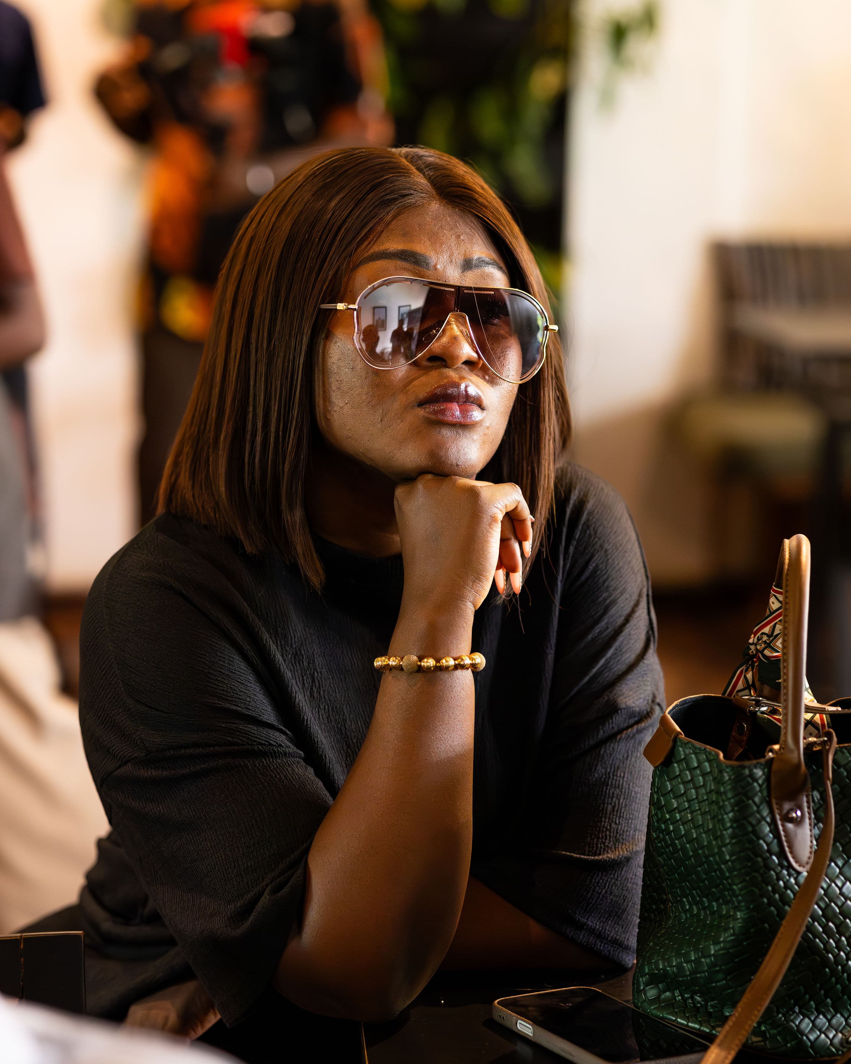 An attendee in a thoughtful moment between sessions